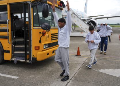 A Honduran migrant celebrates upon arriving at Ramon Villeda Morales Airport in San Pedro Sula, Honduras, after being deported from the U.S., Wednesday, Dec. 4, 2024. (AP Photo/Moises Castillo)