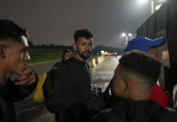 Diego, a Honduran migrant, gets on a bus in the hope of reaching the U.S., after being deported from that country, in San Pedro Sula, Honduras, Tuesday, Dec. 3, 2024. (AP Photo/Moises Castillo)
