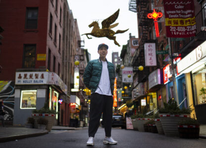 Karho Leung, 33, one of the founders of 12 Pell, a local barbershop, stands for his portrait on Pell Street in Manhattan's Chinatown neighborhood, Thursday, Jan. 25, 2024, in New York. Anchored in the Chinatown community and equally at home elsewhere in the city, Leung says he's 