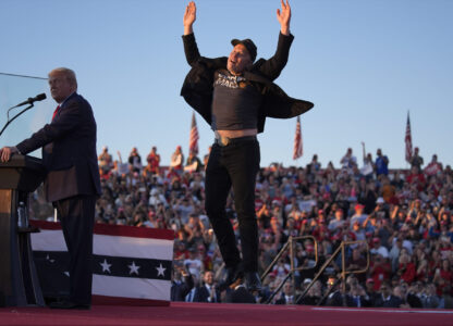 FILE - Elon Musk jumps on the stage as Republican presidential nominee former President Donald Trump speaks at a campaign rally at the Butler Farm Show, Oct. 5, 2024, in Butler, Pa. (AP Photo/Evan Vucci, File)