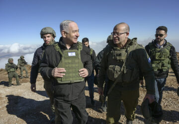 Israel's Prime Minister Benjamin Netanyahu, left, visits Israeli forces in a buffer zone inside Syria, Tuesday, Dec. 17, 2024. (Israel Government Press Office via AP)