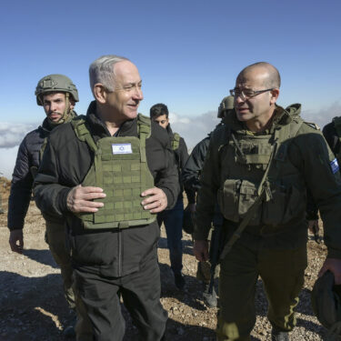 Israel's Prime Minister Benjamin Netanyahu, left, visits Israeli forces in a buffer zone inside Syria, Tuesday, Dec. 17, 2024. (Israel Government Press Office via AP)