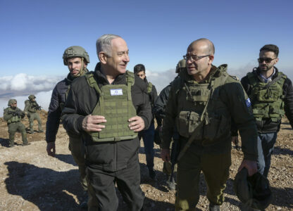 Israel's Prime Minister Benjamin Netanyahu, left, visits Israeli forces in a buffer zone inside Syria, Tuesday, Dec. 17, 2024. (Israel Government Press Office via AP)
