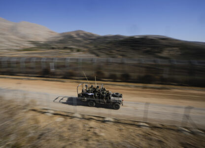 Israeli soldiers stand on an armored vehicle after crossing the security fence along the so-called Alpha Line that separates the Israeli-controlled Golan Heights from Syria, in the town of Majdal Shams, Tuesday, Dec. 17, 2024. (AP Photo/Matias Delacroix)