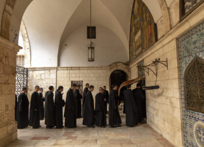 Young seminarians of the Armenian Christian convent arrive for the daily afternoon prayer service at St. James Cathedral at the Armenian quarter in Jerusalem, Thursday, Nov. 21, 2024. (AP Photo/Francisco Seco)