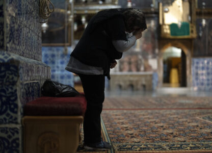 An Armenian Christian worshipper attends the daily afternoon prayer service at the St. James Cathedral at the Armenian quarter in Jerusalem, Thursday, Nov. 21, 2024. (AP Photo/Francisco Seco)