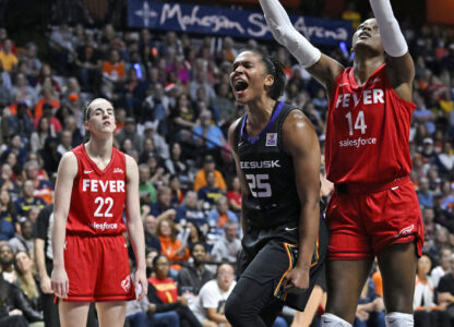 FILE - Connecticut Sun forward Alyssa Thomas (25) celebrates a basket while being fouled during the second half in Game 2 of a first-round WNBA basketball playoff series against the Indiana Fever, Sept. 25, 2024, in Uncasville, Conn. (AP Photo/Jessica Hill, File)