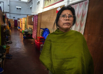 Yengsom Junksom Memi, a Meitei, talks to Associated Press n a relief camp in Imphal, Manipur, Monday, Dec. 16, 2024. Mimi, used to live in Kangpokpi when attackers rampaged her home and forced her family to run for their lives, Memi first took refuge in a police station, before moving to a relief center in Imphal where she lives with other 600 displaced Meiteis. She said her house has since been taken over by the attackers. (AP Photo/Anupam Nath)