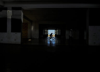 A Meitei boy rides on a bicycle in a relief camp in Imphal, Manipur, Monday, Dec. 16, 2024. (AP Photo/Anupam Nath)
