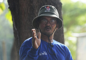 A survivor from tsunami Assistant of village chief Sanya Kongma, talks to the Associated Press reporters during an interview tsunami hit to Ban Nam khem, Takuapa district of Phang Nga province, southern Thailand, Monday, Dec. 9, 2024. (AP Photo/Sakchai Lalit)
