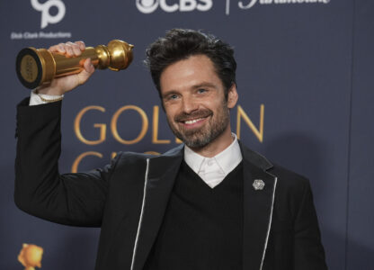 Sebastian Stan poses in the press room with the award for best performance by a male actor in a motion picture - musical or comedy for 
