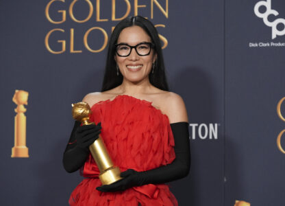 Ali Wong poses in the press room with the award for best performance in stand-up comedy on television for 