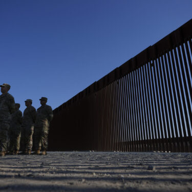 FILE - Members of the California National Guard listne during a news conference near the Otay Mesa Port of Entry along the border with Mexico, Dec. 5, 2024, in San Diego. (AP Photo/Gregory Bull, File)