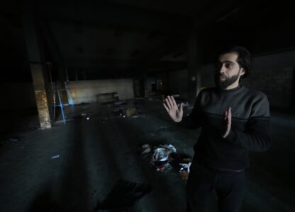 Abdullah Zahra speaks at Branch 215, a detention facility where he was held during Bashar Assad's regime and where members of his family were killed in Damascus, Syria, on Dec. 17, 2024. (AP Photo/Hussein Malla)
