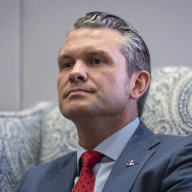 FILE - Pete Hegseth, President-elect Donald Trump's nominee to be defense secretary, responds to reporters during a meeting at the Capitol in Washington, Dec. 5, 2024. (AP Photo/J. Scott Applewhite, File)