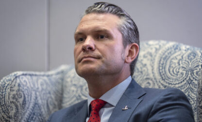 FILE - Pete Hegseth, President-elect Donald Trump's nominee to be defense secretary, responds to reporters during a meeting at the Capitol in Washington, Dec. 5, 2024. (AP Photo/J. Scott Applewhite, File)