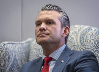FILE - Pete Hegseth, President-elect Donald Trump's nominee to be defense secretary, responds to reporters during a meeting at the Capitol in Washington, Dec. 5, 2024. (AP Photo/J. Scott Applewhite, File)