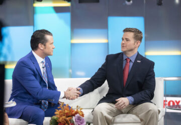 FILE - Pete Hegseth, left, with Fox News, shakes hands with Army 1st Lt. Clint Lorance during his appearance on 