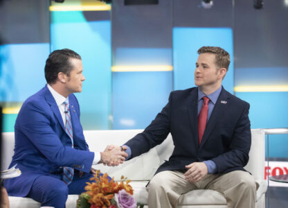 FILE - Pete Hegseth, left, with Fox News, shakes hands with Army 1st Lt. Clint Lorance during his appearance on 