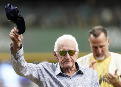FILE - Milwaukee Brewers radio announcer Bob Uecker tips his cap before a baseball game between the Milwaukee Brewers and the Miami Marlins,, July 28, 2024, in Milwaukee. (AP Photo/Aaron Gash)