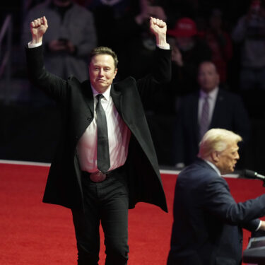 Elon Musk reacts as President-elect Donald Trump speaks at a rally ahead of the 60th Presidential Inauguration, Sunday, Jan. 19, 2025, in Washington. (AP Photo/Alex Brandon)