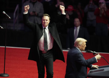 Elon Musk reacts as President-elect Donald Trump speaks at a rally ahead of the 60th Presidential Inauguration, Sunday, Jan. 19, 2025, in Washington. (AP Photo/Alex Brandon)