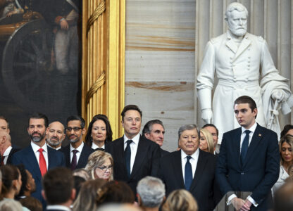 Donald Trump Jr., from left, Howard Lutnick, Sundar Pichai, Elon Musk, Viktor Knavs and and Barron Trump arrive at the 60th Presidential Inauguration in the Rotunda of the U.S. Capitol in Washington, Monday, Jan. 20, 2025. (Kenny Holston/The New York Times via AP, Pool)