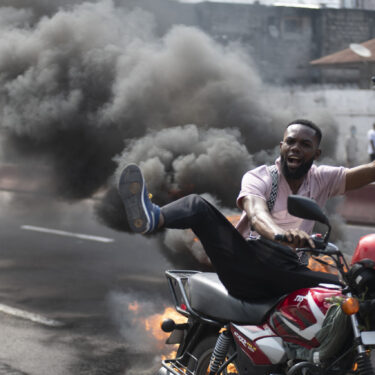 People protest in Kinshasa, Democratic Republic of the Congo Tuesday, Jan. 28, 2025, against the Rwanda-backed M23 rebels' advances into eastern Congo's capital Goma. (AP Photo/Samy Ntumba Shambuyi)
