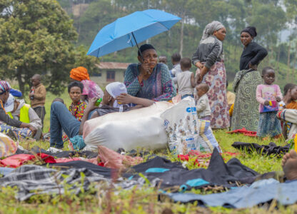 People who crossed from Congo wait for assistance in Gyseny, Rwanda, Tuesday, Jan. 28, 2025, following M23 rebels' advances into eastern Congo's capital Goma. (AP Photo/Yuhi Irakiza)