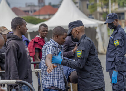 Rwanda security officials check people crossing from Congo in Gyseny, Rwanda, Tuesday, Jan. 28, 2025, following M23 rebels' advances into eastern Congo's capital Goma. (AP Photo/Yuhi Irakiza)