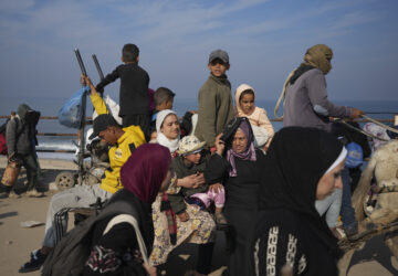 Displaced Palestinians ride in a horse-drawn cart as they return to their homes in the northern Gaza Strip, Tuesday, Jan. 28, 2025, after Israel's decision to allow thousands of them to go back for the first time since the early weeks of the 15-month war with Hamas. (AP Photo/Abdel Kareem Hana)