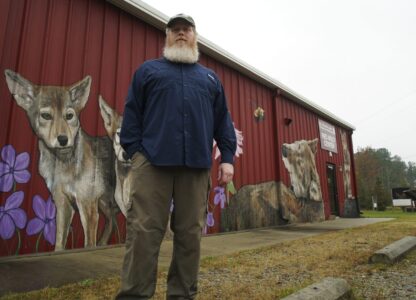 Joe Madison, head of the U.S. Fish and Wildlife's red wolf program, poses for a photo outside the Red Wolf Center in Columbia, N.C., on Wednesday, Nov. 20, 2024. (AP Photo/Allen G. Breed)