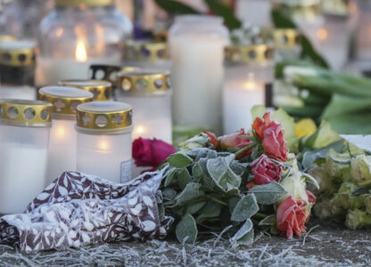 Hoarfrost covered the flowers at a makeshift memorial near the scene of a shooting at an adult education center on the outskirts of Orebro, Sweden, Thursday, Feb. 6, 2025. (AP Photo/Sergei Grits)