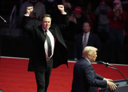 FILE - Elon Musk reacts as President-elect Donald Trump speaks at a rally ahead of the 60th Presidential Inauguration, Jan. 19, 2025, in Washington. (AP Photo/Alex Brandon, File)