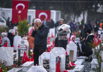 FILE - People visit graves in a cemetery where some of the victims of the earthquake in Feb. 2023 are buried in Antakya, southern Turkey, Tuesday, Feb. 6, 2024. (AP Photo/Metin Yoksu, File)