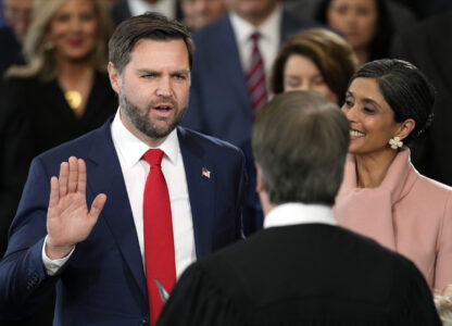 JD Vance is sworn in as vice president by Supreme Court Justice Brett Kavanaugh as Usha Vance holds the Bible during the 60th Presidential Inauguration in the Rotunda of the U.S. Capitol in Washington, Monday, Jan. 20, 2025. (AP Photo/Julia Demaree Nikhinson, Pool)
