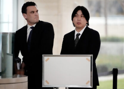 Ippei Mizuhara, right, former interpreter for Los Angeles Dodgers baseball star Shohei Ohtani arrives at federal court with his attorney Michael G. Freedman for sentencing for bank and tax fraud on Thursday, Feb. 6, 2025, in Santa Ana, Calif. (AP Photo/Damian Dovarganes)