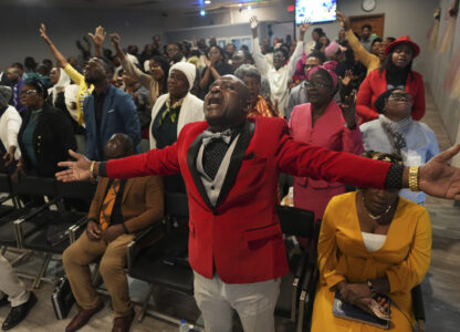 Jean-Michel Gisnel cries out while praying with other congregants at the First Haitian Evangelical Church of Springfield, Sunday, January 26, 2025, in Springfield, Ohio. (AP Photo/Luis Andres Henao)