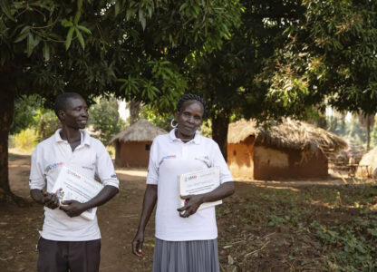 This photo provided by World Relief shows care group volunteers Neimate Mustafa and John Simon Mbiliwele, who provide community health education, visiting a homestead in January 2022, in Maridi, South Sudan. (Esther Mbabazi/World Relief via AP)