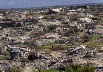 Destroyed houses caused by the Israeli air and ground offensive, in the town of Kfar Kila, southern Lebanon, Tuesday, Feb. 18, 2025. (AP Photo/Hassan Ammar)