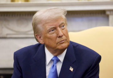 President Donald Trump listens during a meeting with France's President Emmanuel Macron in the Oval Office of the White House in Washington, Monday, Feb. 24, 2025. (Ludovic Marin/Pool via AP)
