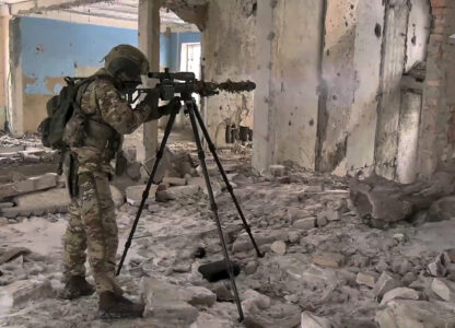 In this photo taken from video distributed by Russian Defense Ministry Press Service on Wednesday, Feb. 26, 2025, A Russian Army sniper fires toward Ukrainian position at an undisclosed location in Ukraine. (Russian Defense Ministry Press Service via AP)