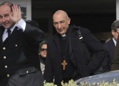 Cardinal Baldassare Reina, right, leaves the Agostino Gemelli Polyclinic, where Pope Francis has been hospitalized since Feb. 14, in Rome, Wednesday, Feb. 26, 2025. (AP Photo/Kirsty Wigglesworth)