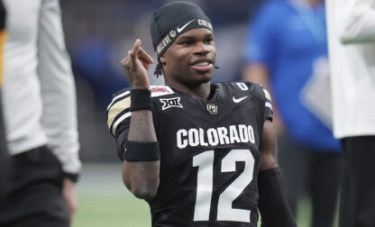 FILE - Colorado wide receiver Travis Hunter (12) warms up for the Alamo Bowl NCAA college football game against BYU, Dec. 28, 2024, in San Antonio. (AP Photo/Eric Gay, File)