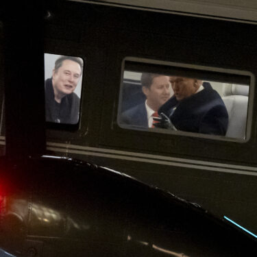 FILE - Elon Musk, left, and President Donald Trump, right, are seen through the windows as Marine One lands on the South Lawn of the White House, Feb. 19, 2025, in Washington. (AP Photo/Alex Brandon, File)