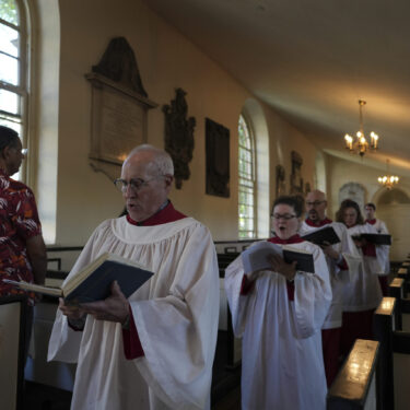 FILE - Choir members sing hymns at Christ Church in Philadelphia during Sunday service, Oct. 6, 2024. (AP Photo/Luis Andres Henao, File)