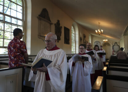 FILE - Choir members sing hymns at Christ Church in Philadelphia during Sunday service, Oct. 6, 2024. (AP Photo/Luis Andres Henao, File)