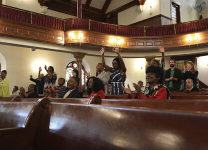 FILE - Mother Bethel AME Church congregants react to the sermon by senior pastor, Rev. Mark Tyler, in Philadelphia, Sept. 29, 2024. (AP Photo/Luis Andres Henao, File)