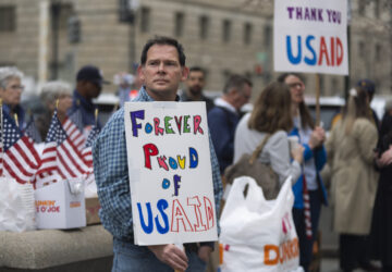 Former United States Agency for International Development (USAID) workers show their support to USAID workers retrieving their personal belongings from USAID's headquarters in Washington, Thursday, Feb. 27, 2025. (AP Photo/Manuel Balce Ceneta)
