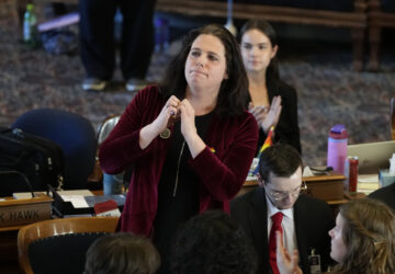 Rep. Aime Wichtendahl, D-Hiawatha, reacts to the gallery after speaking during debate on the gender identity bill, Thursday, Feb. 27, 2025, at the Statehouse in Des Moines, Iowa. (AP Photo/Charlie Neibergall)